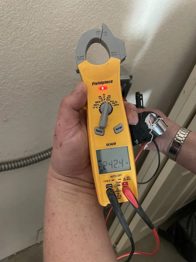 Voltage testing with clamp meter during Generator Installation in Fort Wayne